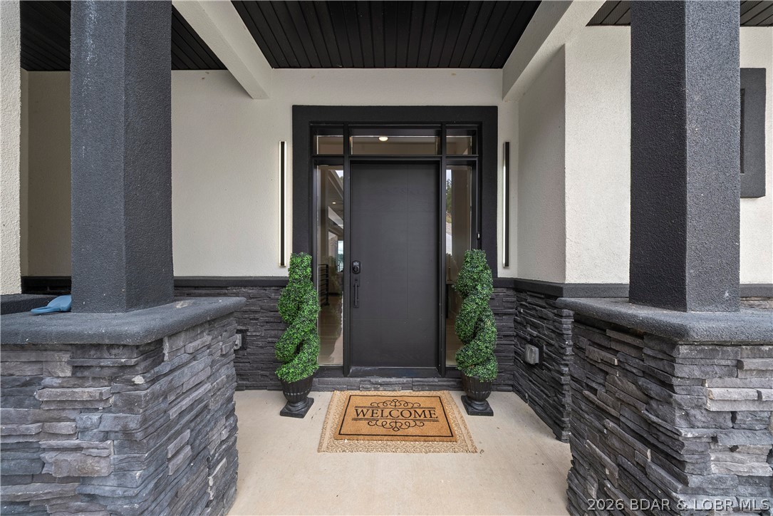 439 Red Bud Road Lake Ozark, MO 65049 - Photo 8 of 98 Welcoming covered front entry featuring modern sto