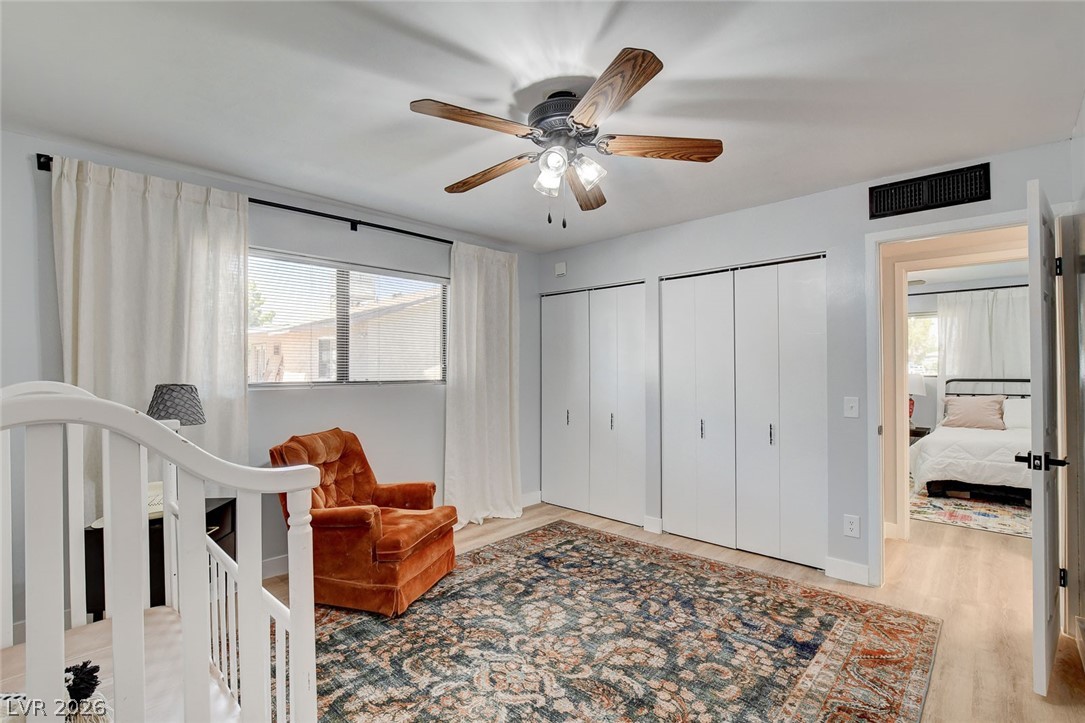 3765 Berkeley Street Logandale, NV 89021 - Photo 42 of 87 This bedroom features bright windows, a convenient closet, and inviting LVP flooring.