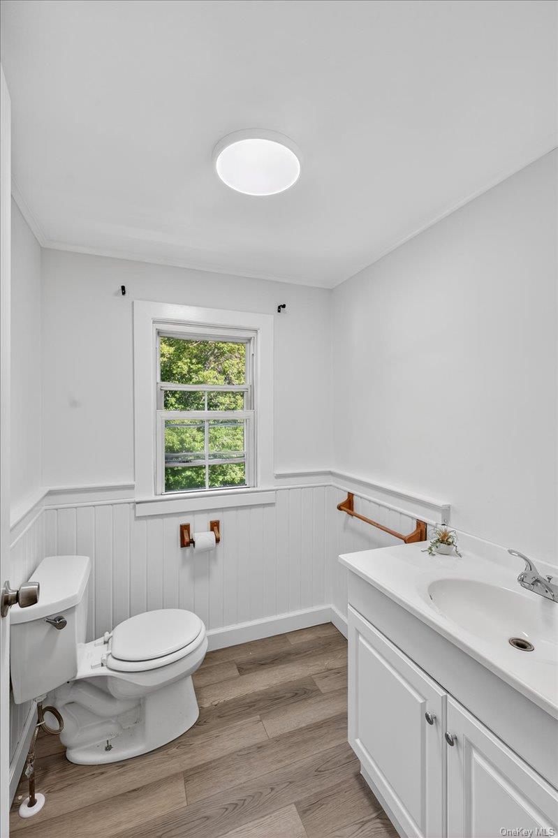 188 Donegan Avenue East Patchogue, NY 11772 - Photo 11 of 25 a bathroom with a toilet sink and mirror
