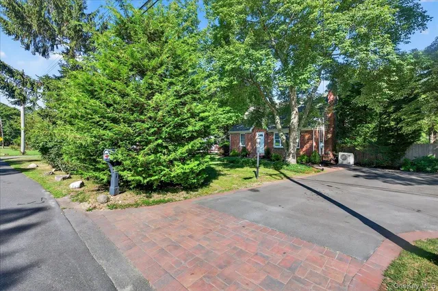 a house with a yard and a trees