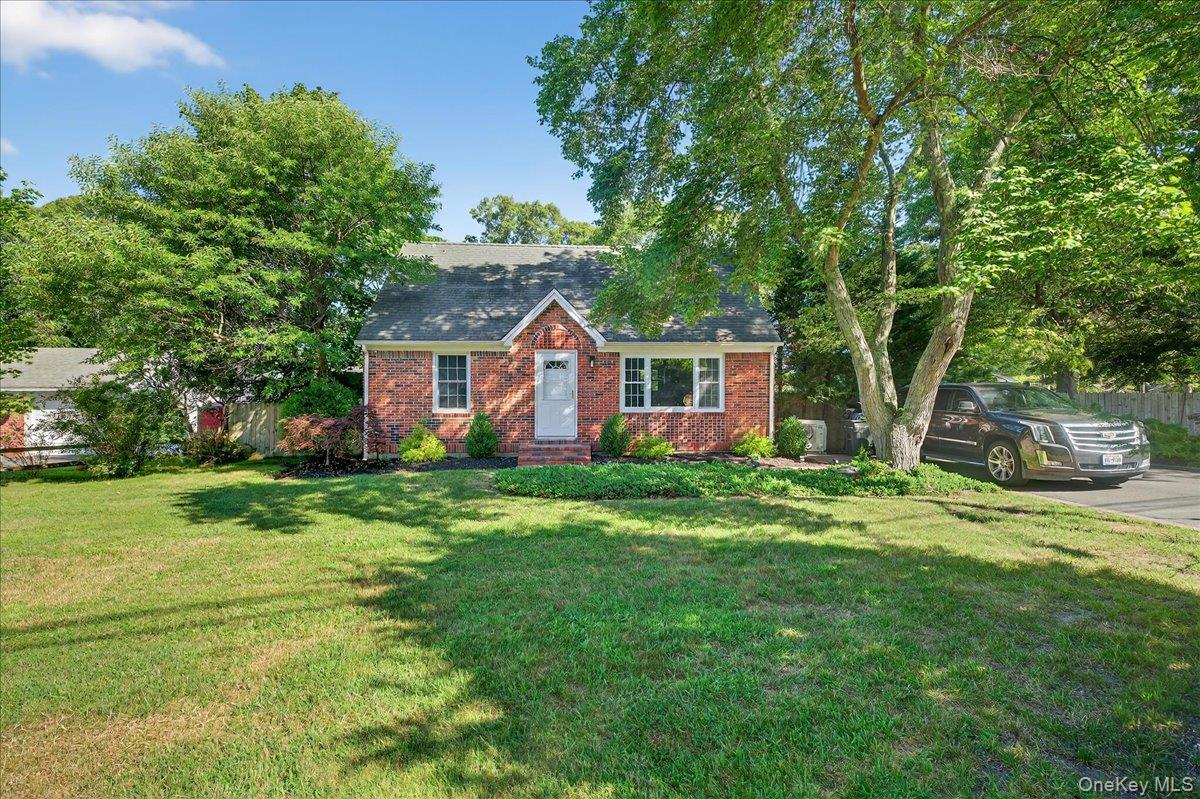 188 Donegan Avenue East Patchogue, NY 11772 - Photo 18 of 25 a view of a house with a backyard
