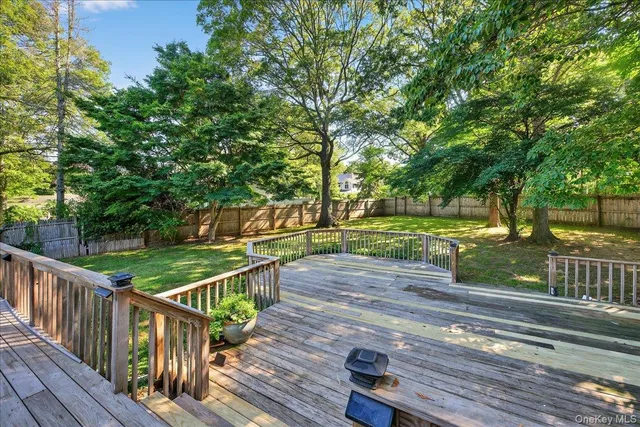 a view of a deck with a yard
