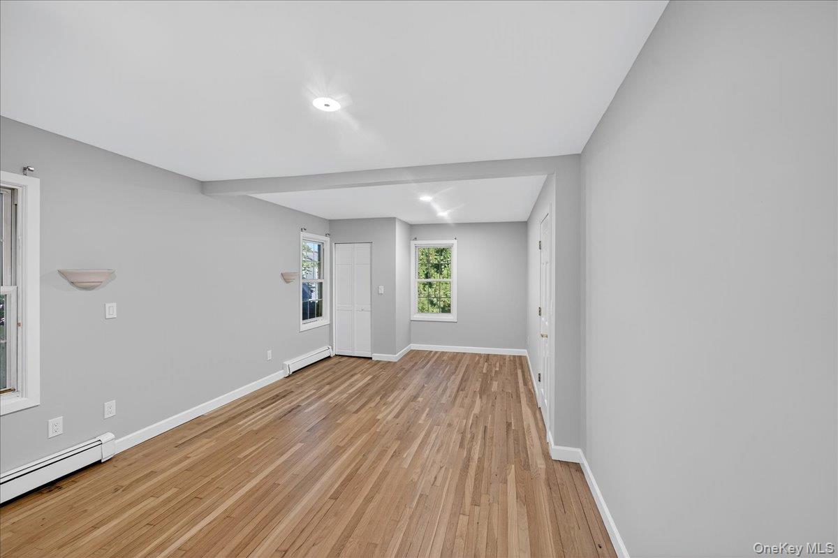 188 Donegan Avenue East Patchogue, NY 11772 - Photo 22 of 25 a view of room with window and hardwood floor