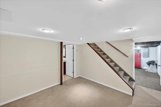 a view of an empty room with stairs