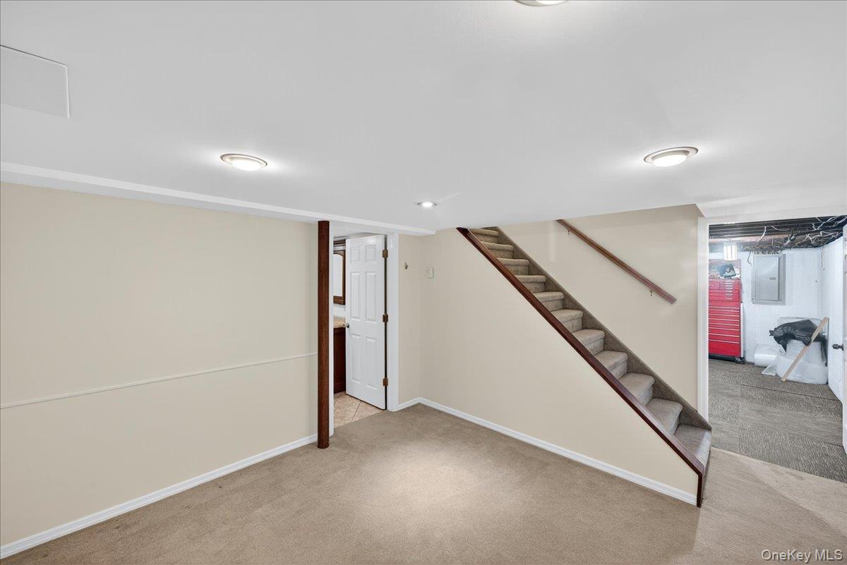 188 Donegan Avenue East Patchogue, NY 11772 - Photo 10 of 25 a view of an empty room with stairs