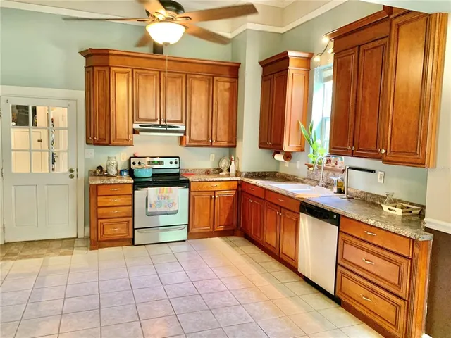 a view of a dining room with furniture and window