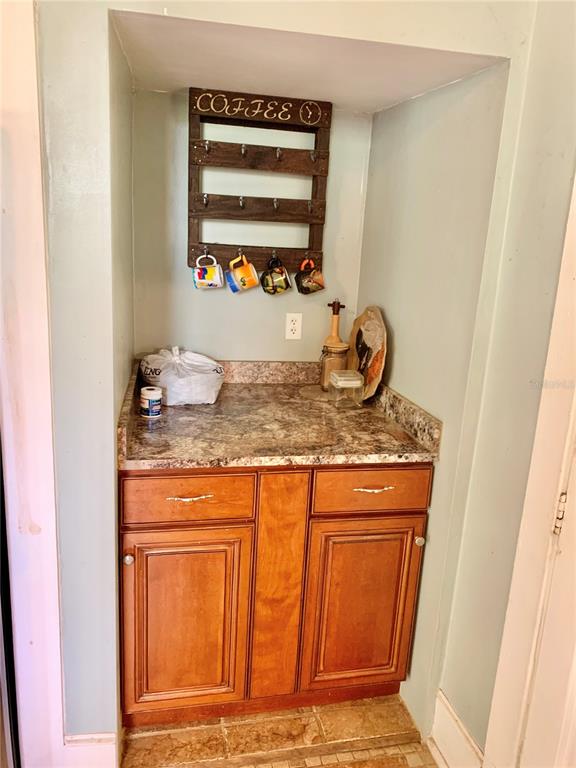 9150 Southwest 151st Lane Archer, FL 32618 - Photo 13 of 81 a bathroom with a granite countertop sink and a mirror