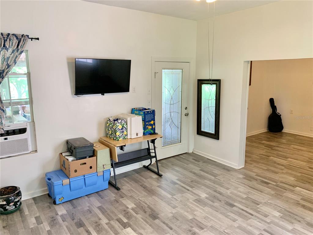 9150 Southwest 151st Lane Archer, FL 32618 - Photo 20 of 81 a living room with furniture and a flat screen tv