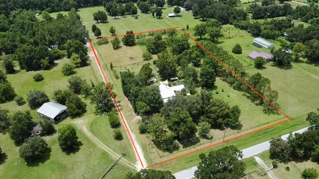 9150 Southwest 151st Lane Archer, FL 32618 - Photo 2 of 81 an aerial view of residential house with outdoor space and street view