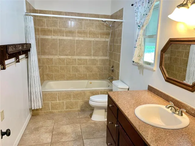 a view of a kitchen with a sink and cabinets