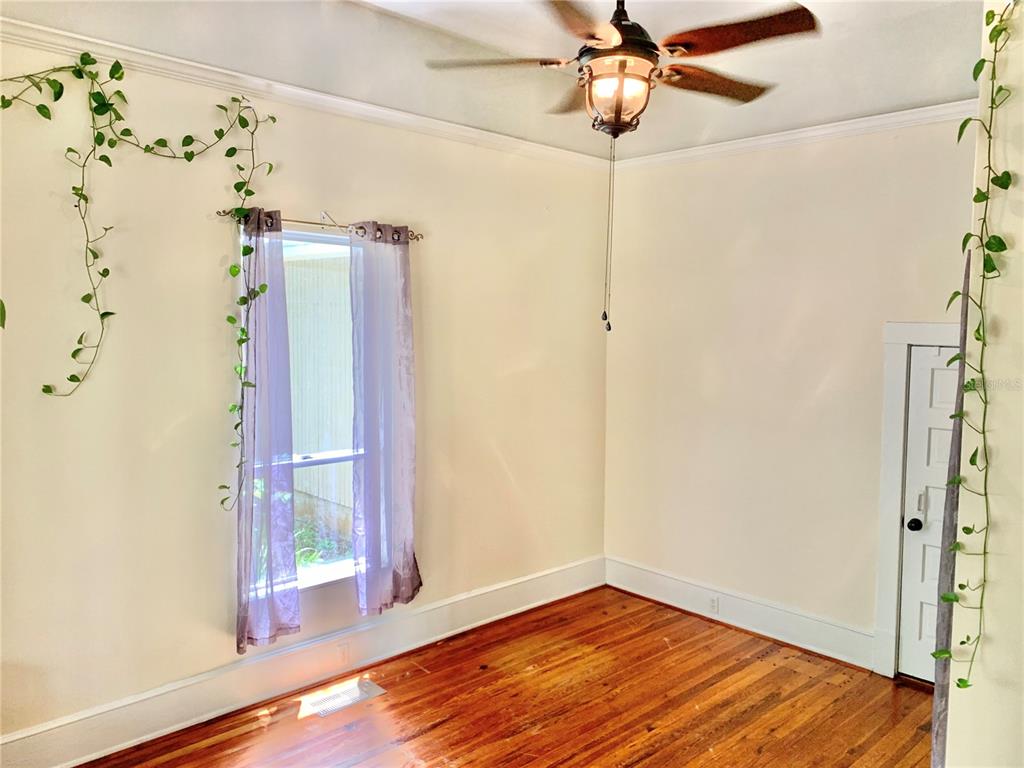 9150 Southwest 151st Lane Archer, FL 32618 - Photo 23 of 81 a view of empty room with wooden floor and fan