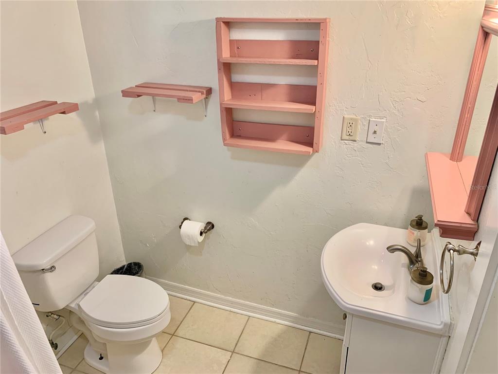 9150 Southwest 151st Lane Archer, FL 32618 - Photo 26 of 81 a bathroom with a sink and a toilet