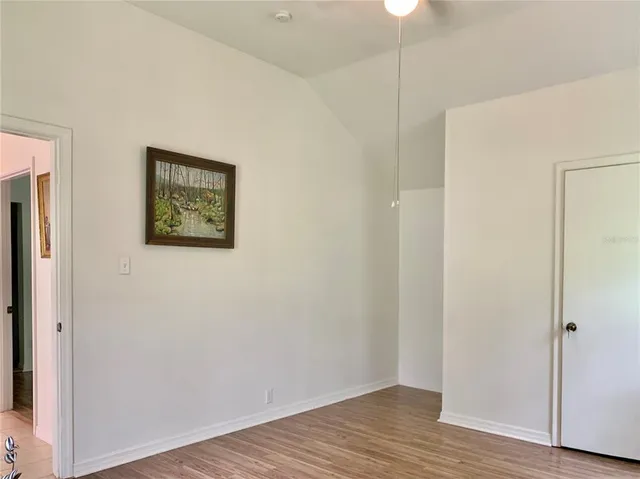 a backyard of a house with yard and outdoor seating