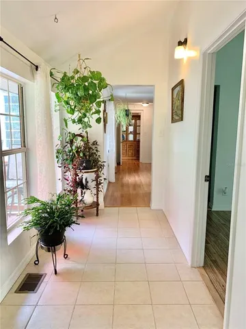 a view of a big yard with lots of green space