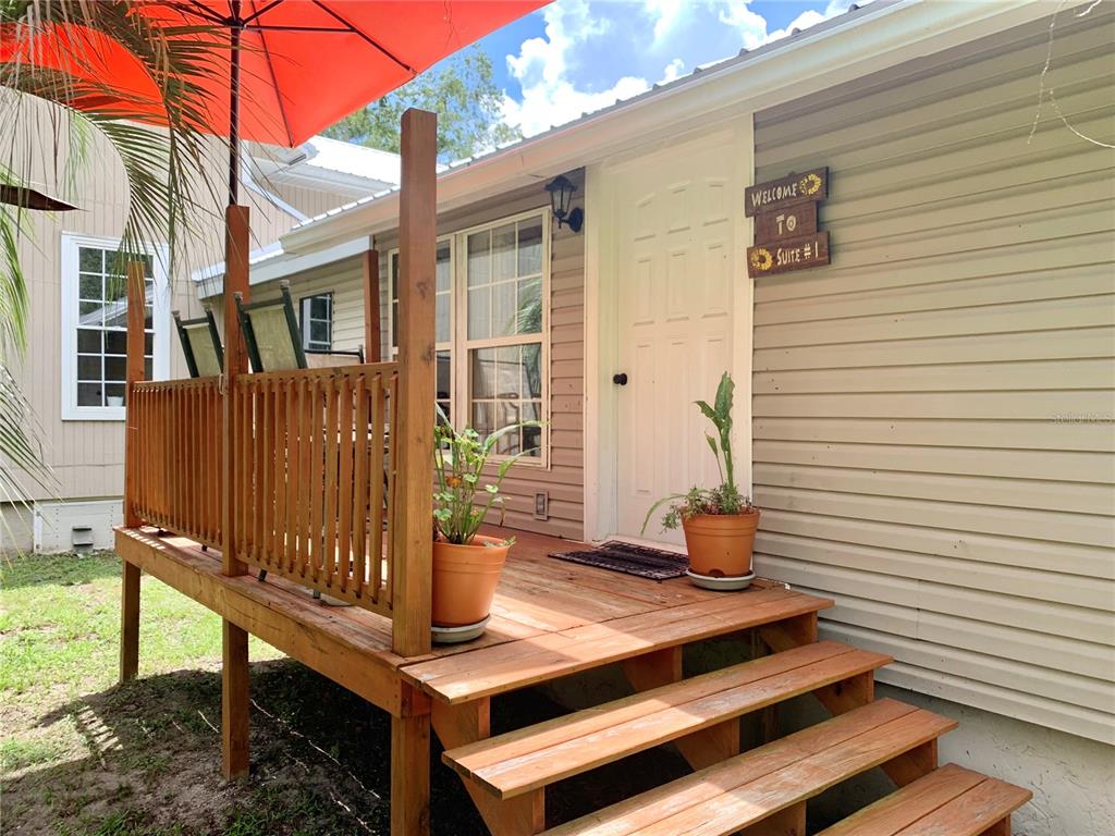 9150 Southwest 151st Lane Archer, FL 32618 - Photo 39 of 81 a view of a patio with a table and chairs