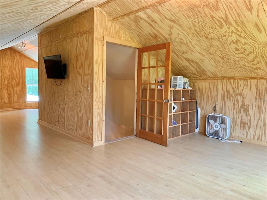 9150 Southwest 151st Lane Archer, FL 32618 - Photo 41 of 81 a view of a room with wooden walls