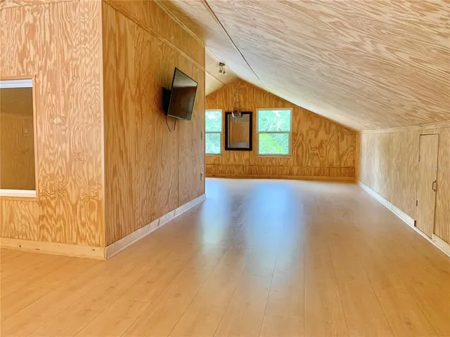 an aerial view of a house with a garden