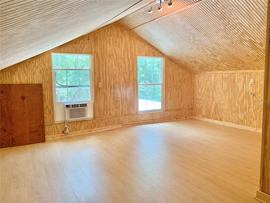 9150 Southwest 151st Lane Archer, FL 32618 - Photo 44 of 81 an empty room with wooden floor and windows