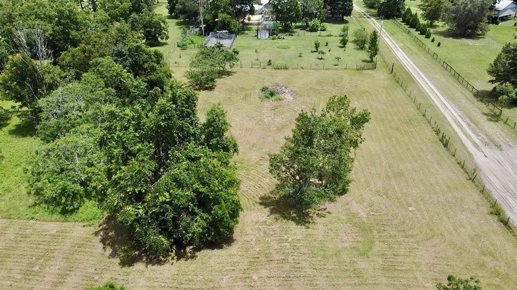9150 Southwest 151st Lane Archer, FL 32618 - Photo 63 of 81 a view of a lake with a yard