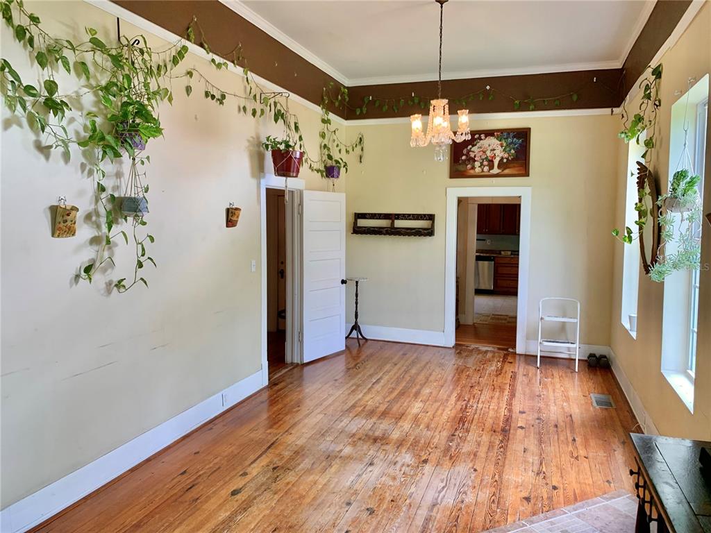 9150 Southwest 151st Lane Archer, FL 32618 - Photo 9 of 81 a view of a refrigerator in kitchen and an empty room