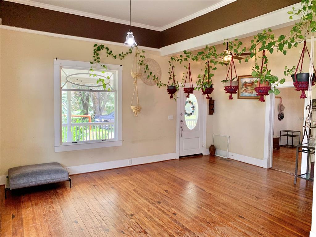 9150 Southwest 151st Lane Archer, FL 32618 - Photo 10 of 81 a view of a livingroom with wooden floor and a window