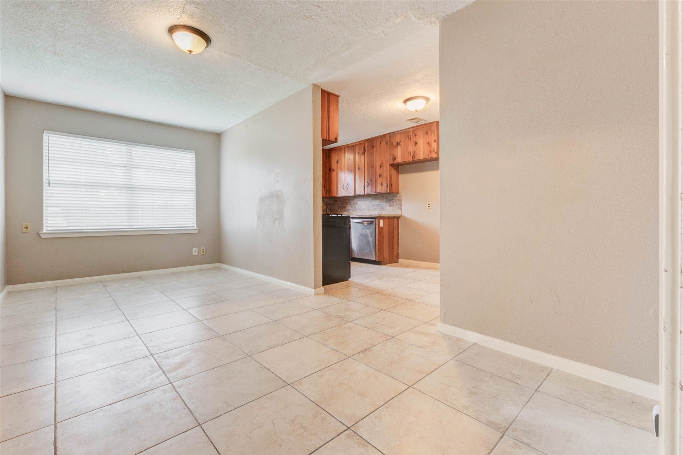 411 Burke Road Pasadena, TX 77506 - Photo 12 of 24 a view of a kitchen with a sink and a window