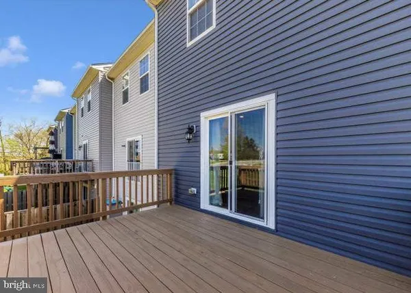 a view of a pathway of a house with a yard