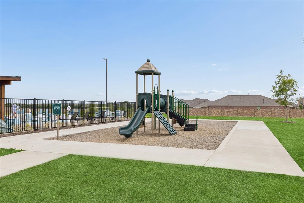 14163 Kempt Drive Pilot Point, TX 76258 - Photo 26 of 29 Community playground located adjacent to the resort-style pool and clubhouse, offering fun and recreation for residents of all ages.