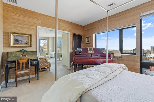 a bed room with a bed and a chair