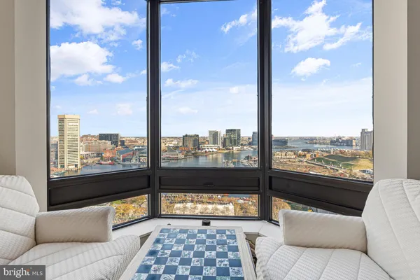 a view of a balcony with furniture