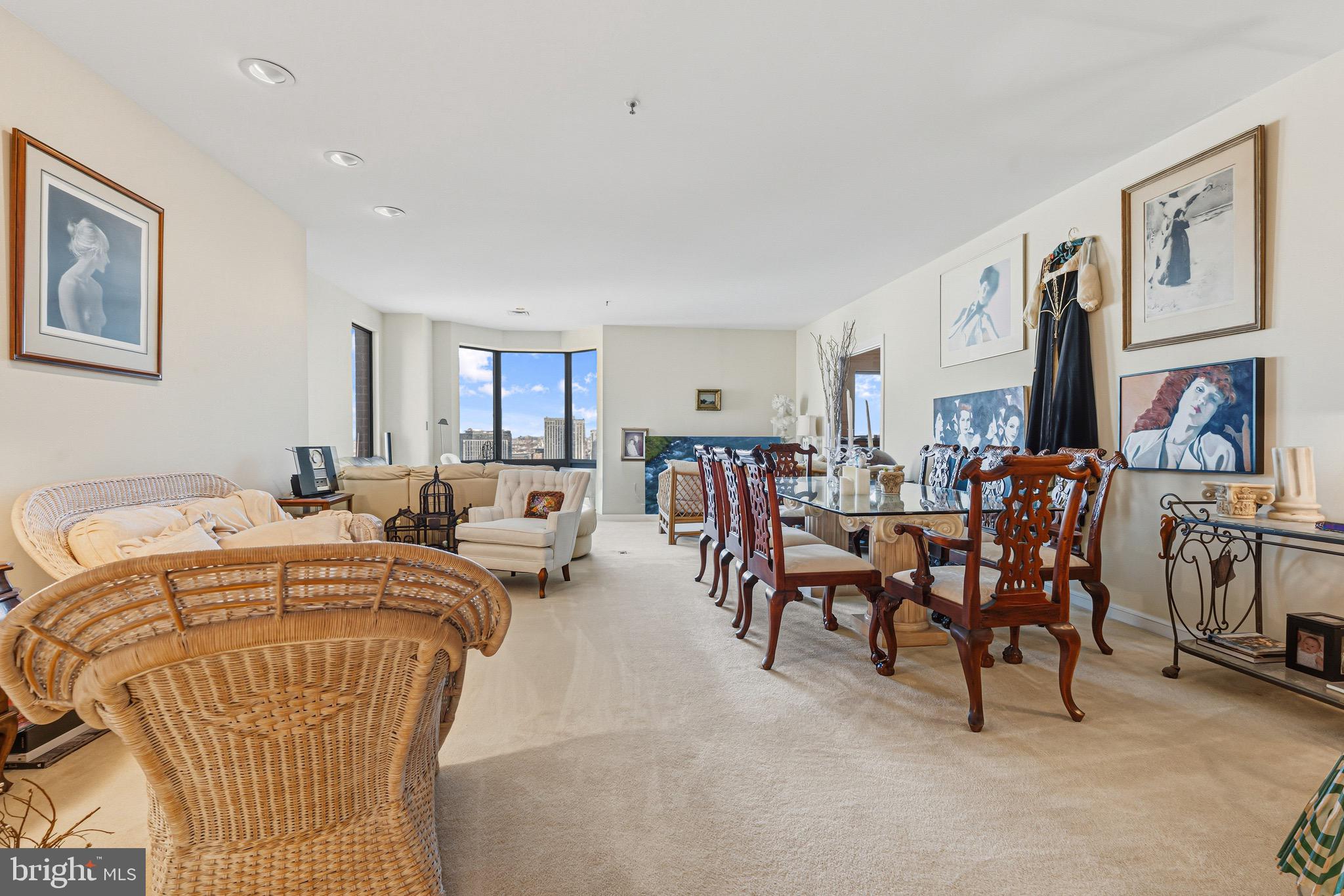 10 East Lee Street, Unit 2008 Baltimore, MD 21202 - Photo 7 of 23 a living room with lots of furniture and painting on the wall