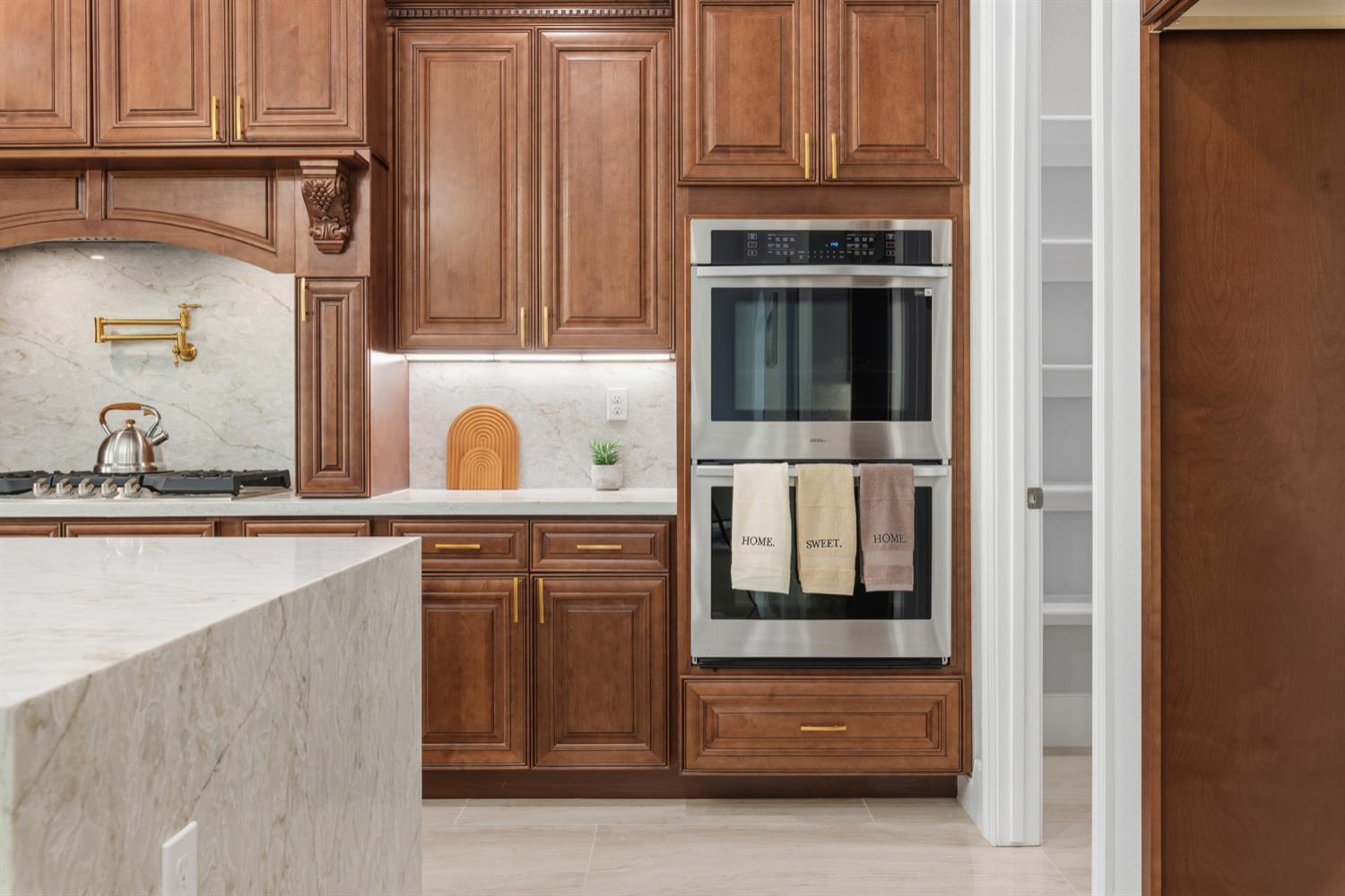 2009 Robin Hood Lane Merced, CA 95340 - Photo 16 of 50 a kitchen with stainless steel appliances granite countertop a refrigerator and a sink
