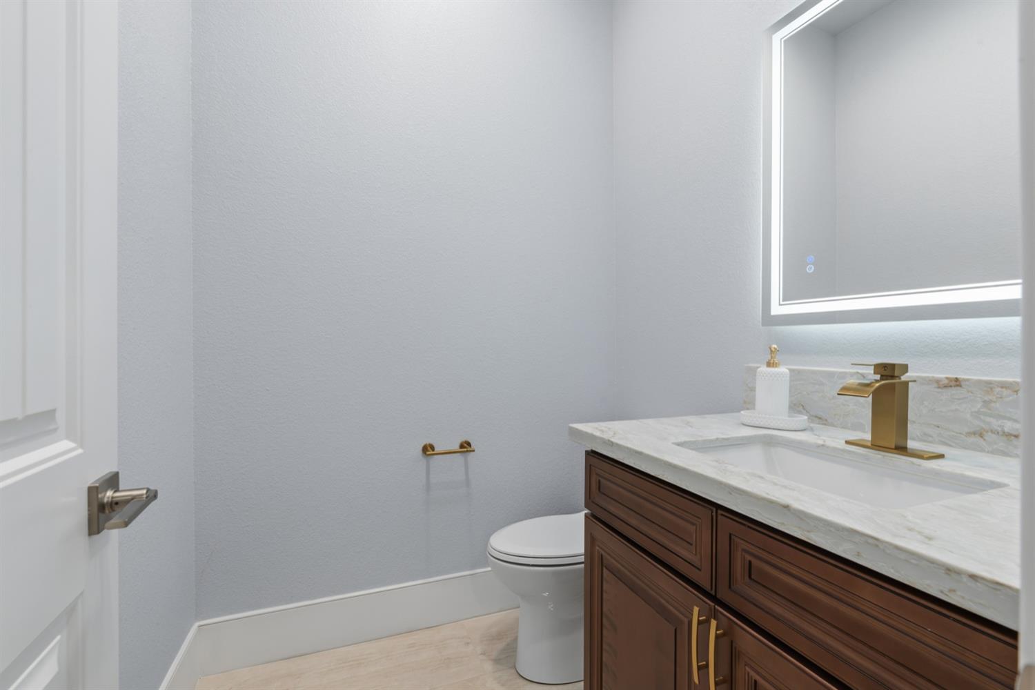 2009 Robin Hood Lane Merced, CA 95340 - Photo 17 of 50 a bathroom with a granite countertop toilet and sink