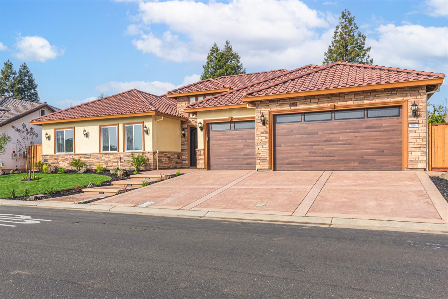 2009 Robin Hood Lane Merced, CA 95340 - Photo 2 of 50 a front view of a house with a yard and garage