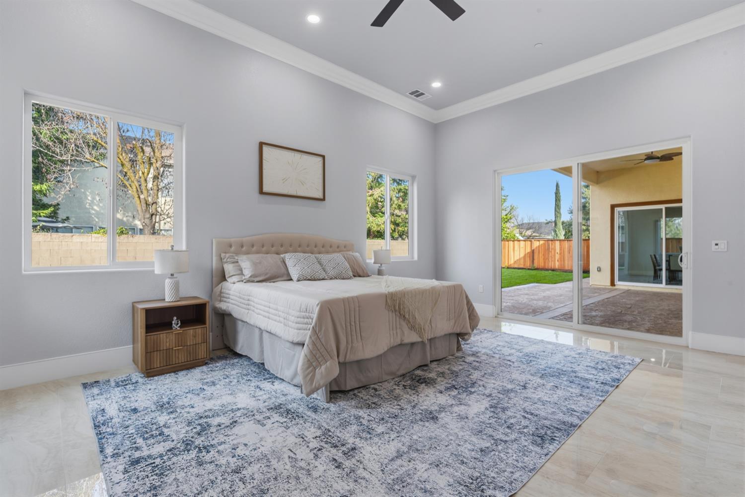 2009 Robin Hood Lane Merced, CA 95340 - Photo 22 of 50 a spacious bedroom with a bed and a couch