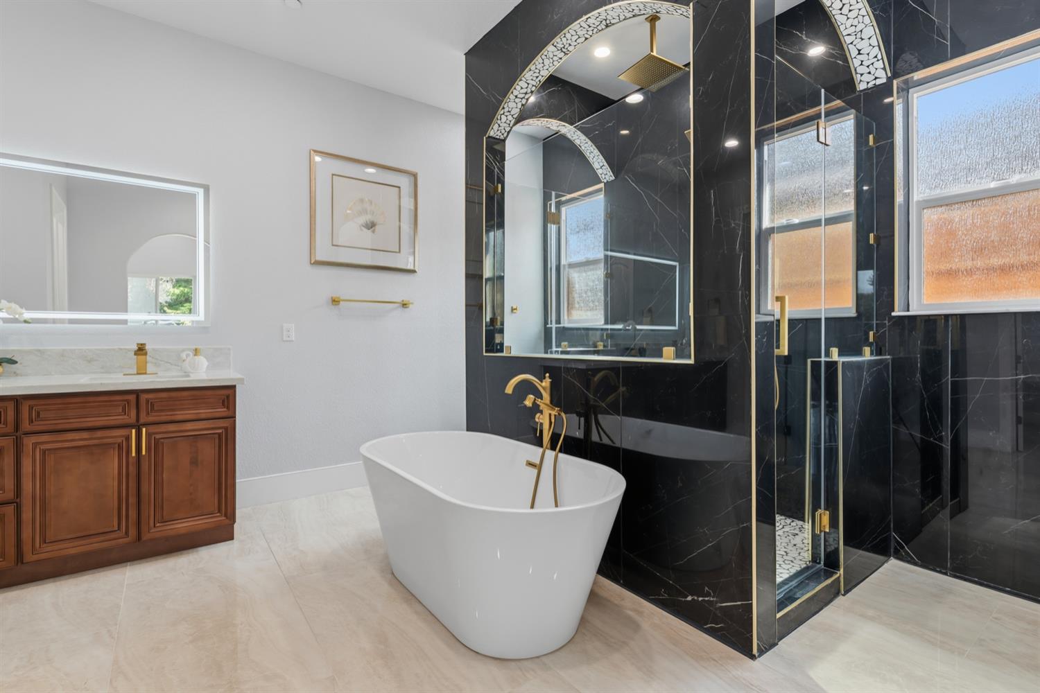 2009 Robin Hood Lane Merced, CA 95340 - Photo 23 of 50 a bathroom with a tub sink and mirror