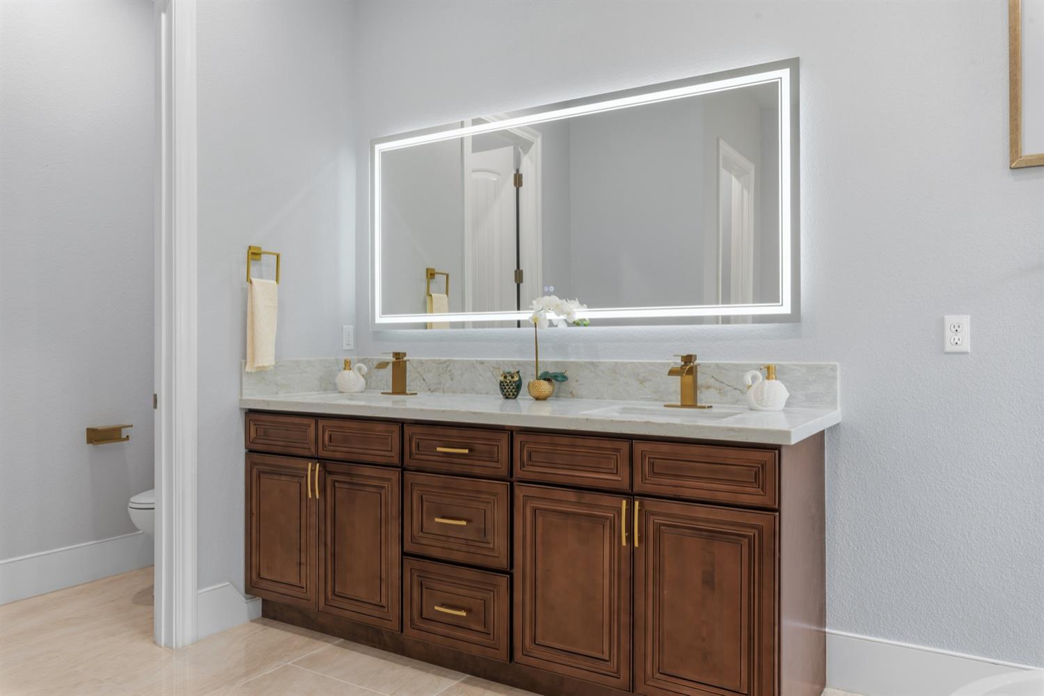 2009 Robin Hood Lane Merced, CA 95340 - Photo 25 of 50 a bathroom with a granite countertop sink and a mirror