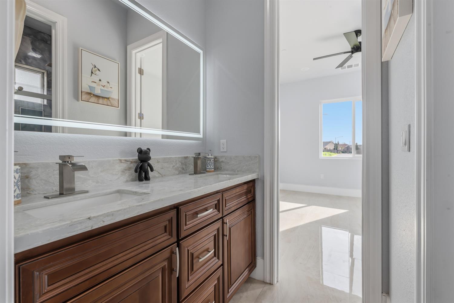 2009 Robin Hood Lane Merced, CA 95340 - Photo 32 of 50 a bathroom with a sink and a mirror