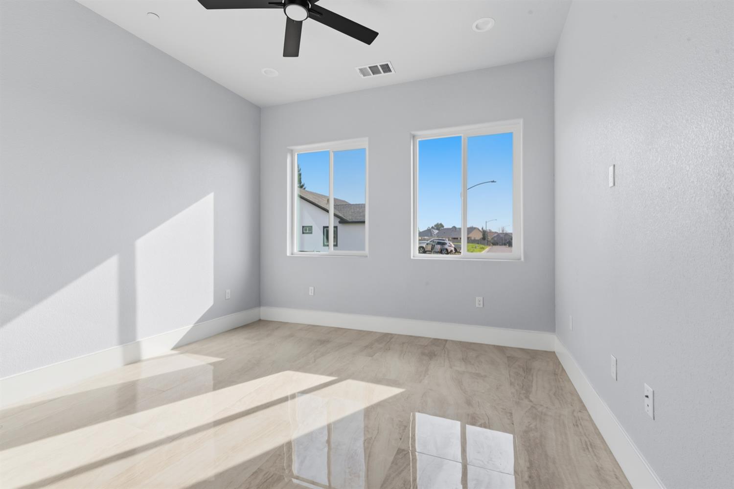 2009 Robin Hood Lane Merced, CA 95340 - Photo 36 of 50 an empty room with windows and fan