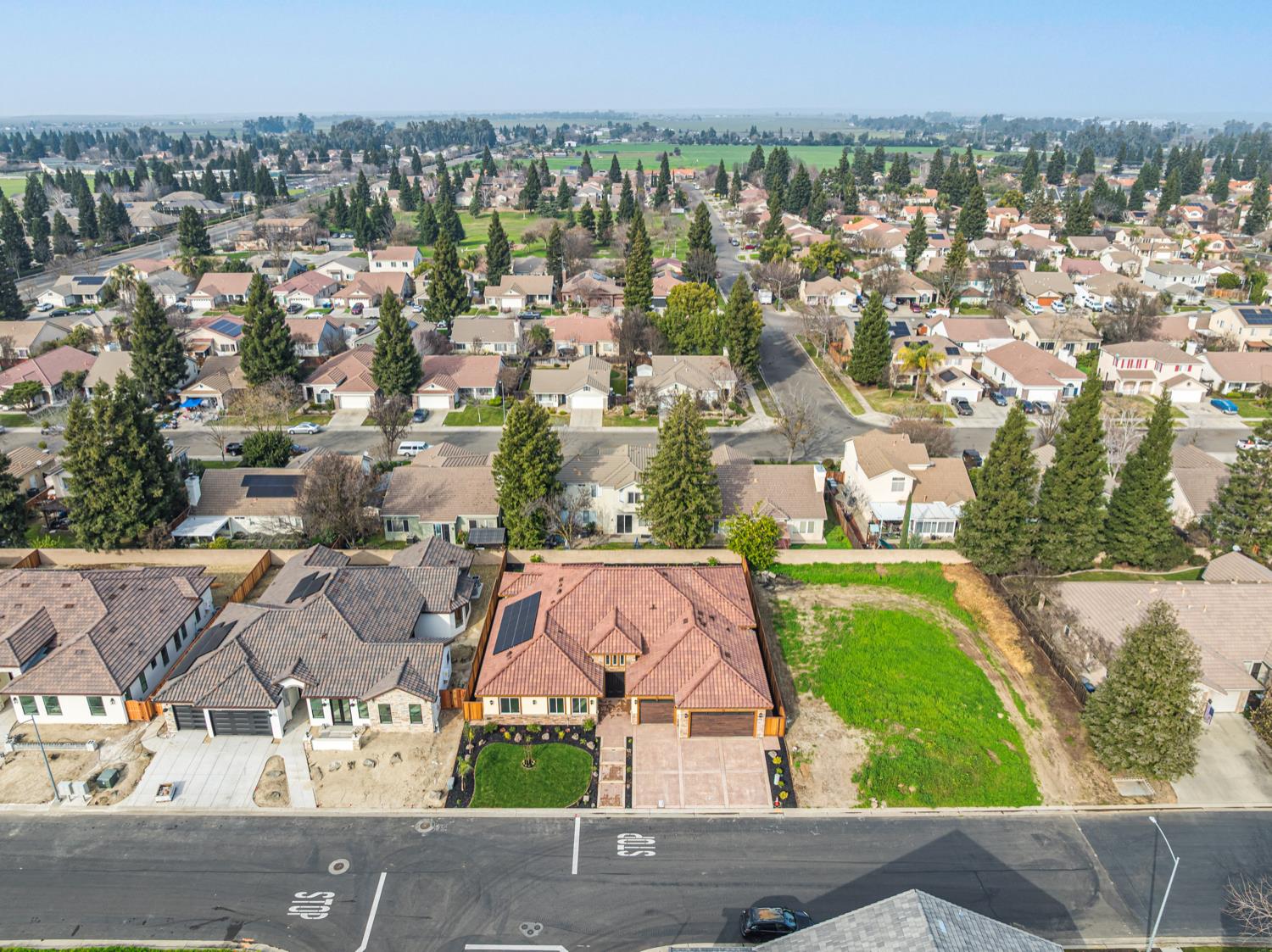 2009 Robin Hood Lane Merced, CA 95340 - Photo 46 of 50 an aerial view of residential houses with outdoor space and trees