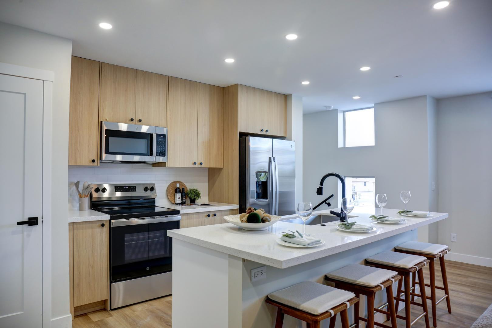 630 North Power Road, Unit 111 Mesa, AZ 85205 - Photo 12 of 13 a kitchen with a sink stainless steel appliances and cabinets