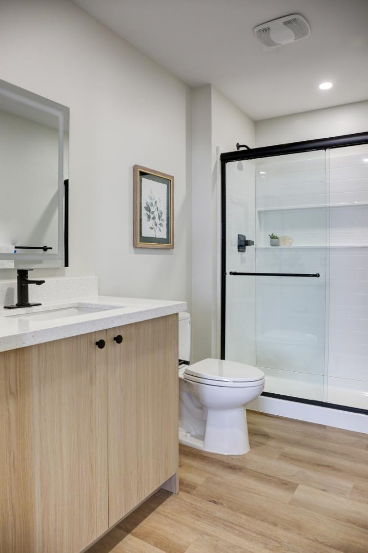 630 North Power Road, Unit 111 Mesa, AZ 85205 - Photo 13 of 13 a bathroom with a sink a toilet a mirror and shower