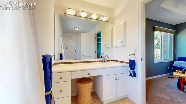 a spacious bathroom with a sink a mirror and a bathtub