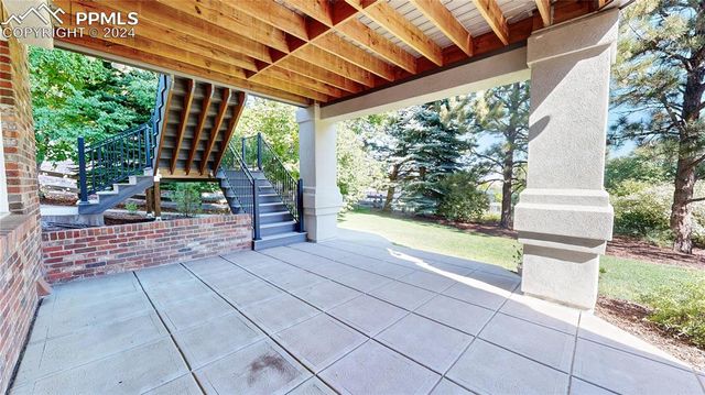 a view of swimming pool with a patio