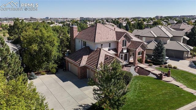 an aerial view of a house with a garden