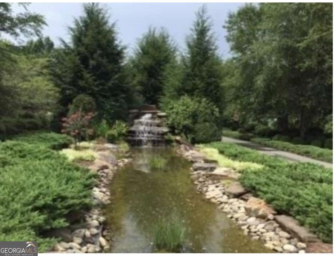 74 Grizzle Court Talking Rock, GA 30175 - Photo 6 of 6 a view of a lake with trees all around
