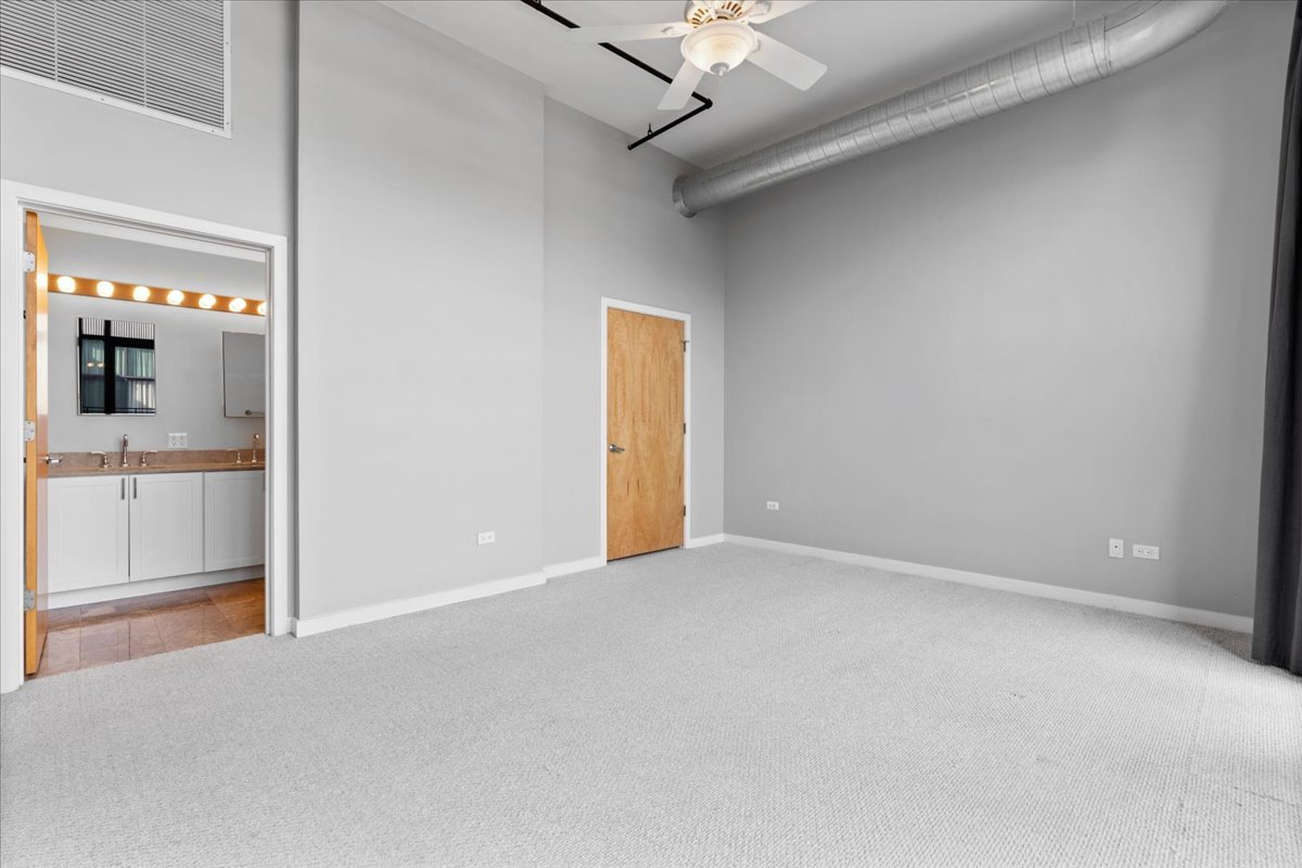 1224 West Van Buren Street, Unit 809 Chicago, IL 60607 - Photo 12 of 25 an empty room with a bathroom