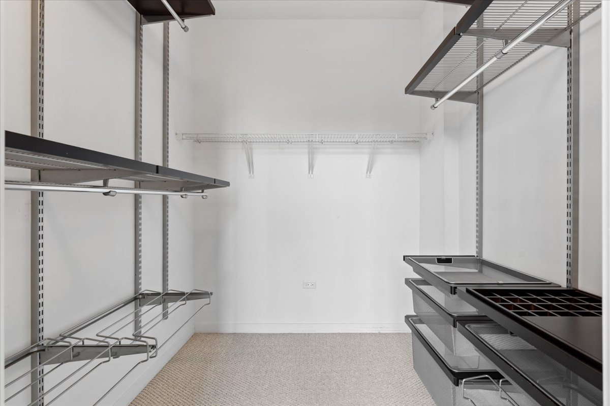 1224 West Van Buren Street, Unit 809 Chicago, IL 60607 - Photo 15 of 25 a view of a room with rack on the wall