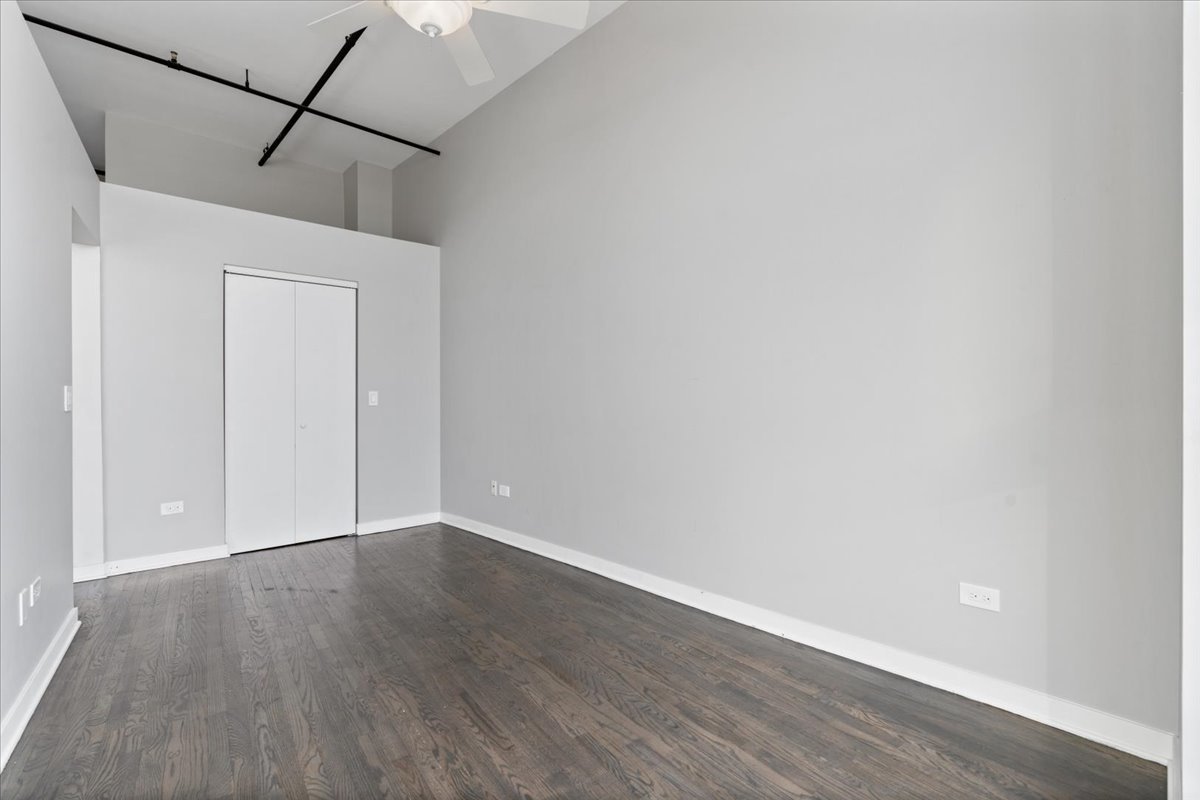 1224 West Van Buren Street, Unit 809 Chicago, IL 60607 - Photo 23 of 25 a view of a small space with wooden floor