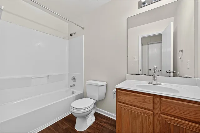 a bathroom with a sink a toilet and a bathtub